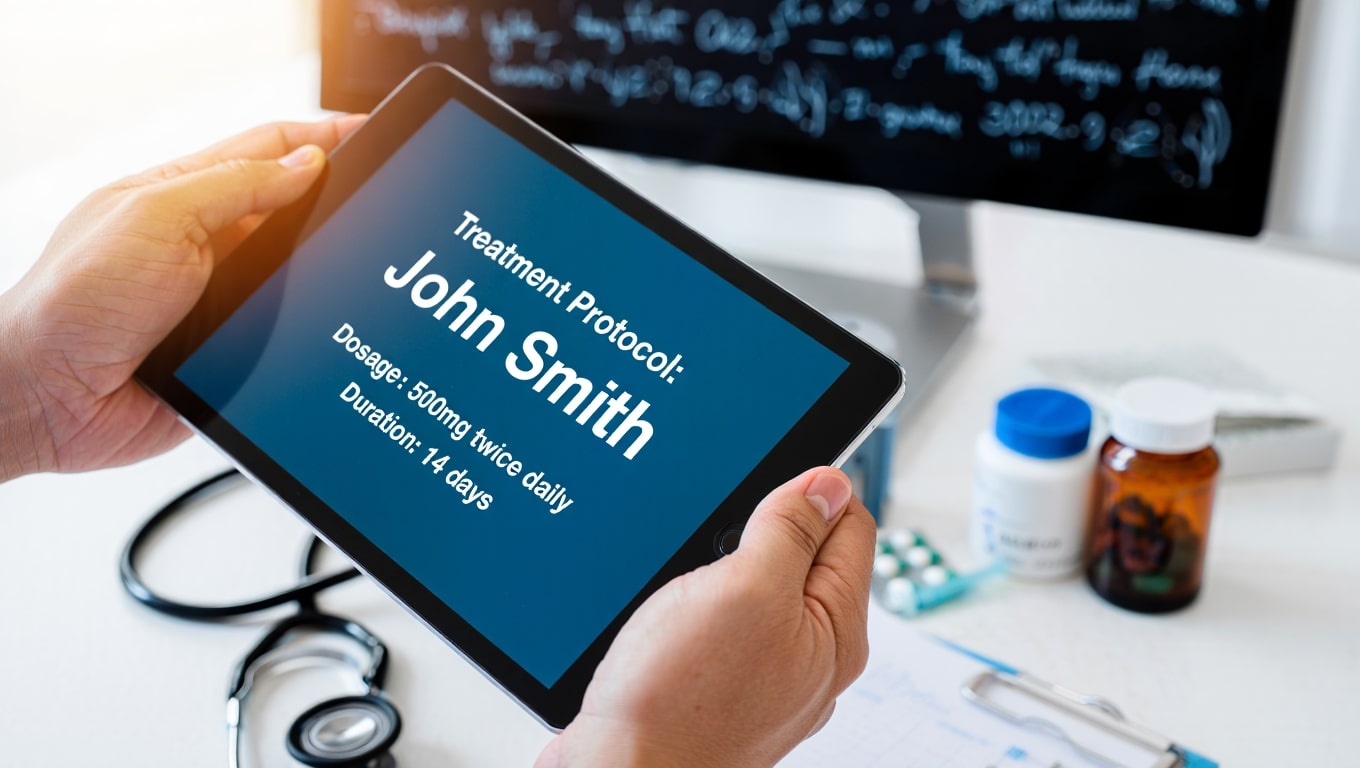 doctor-reviewing-patient-treatment-protocol-on-tablet-with-medical-supplies